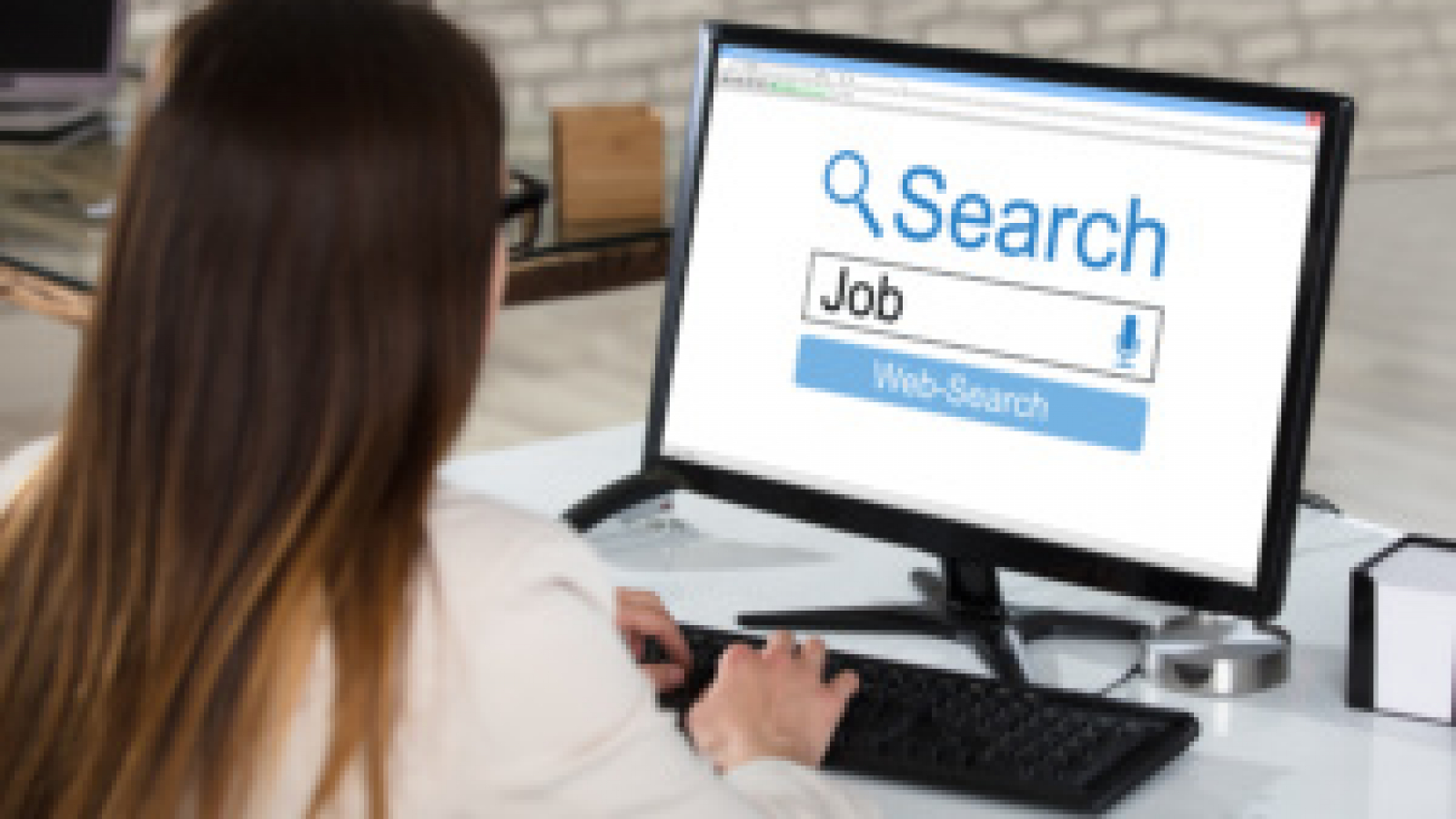 Businesswoman Searching Online Job In Office